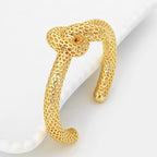 SU Gold Infinity Knot Cuff